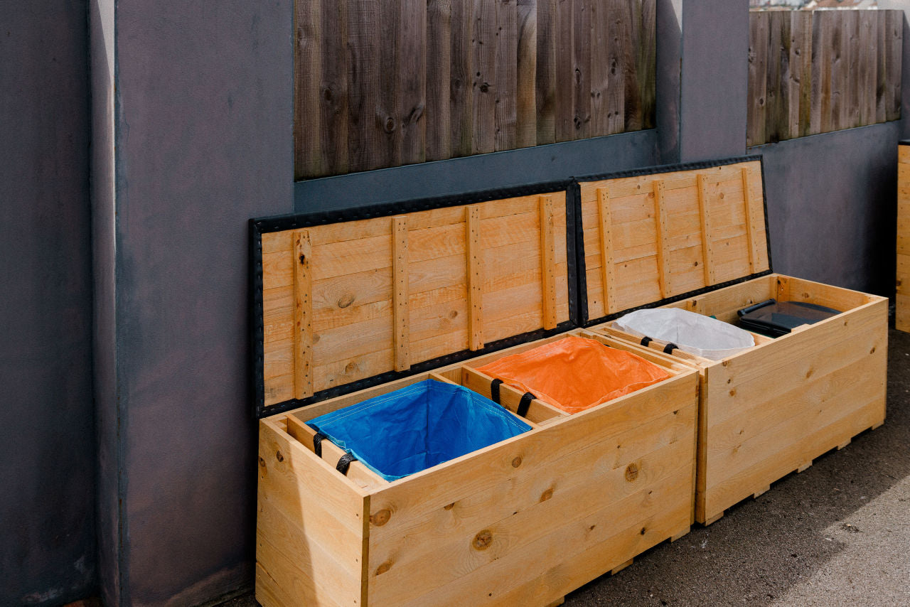 Two Solid Recycling Storage Benches